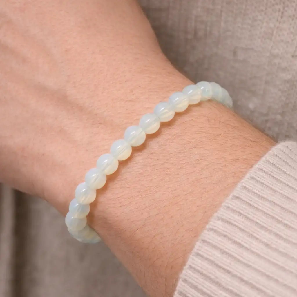 Person Wearing Opal Bracelet