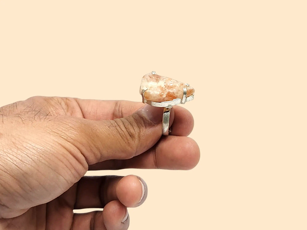 Raw Sunstone Ring in hand