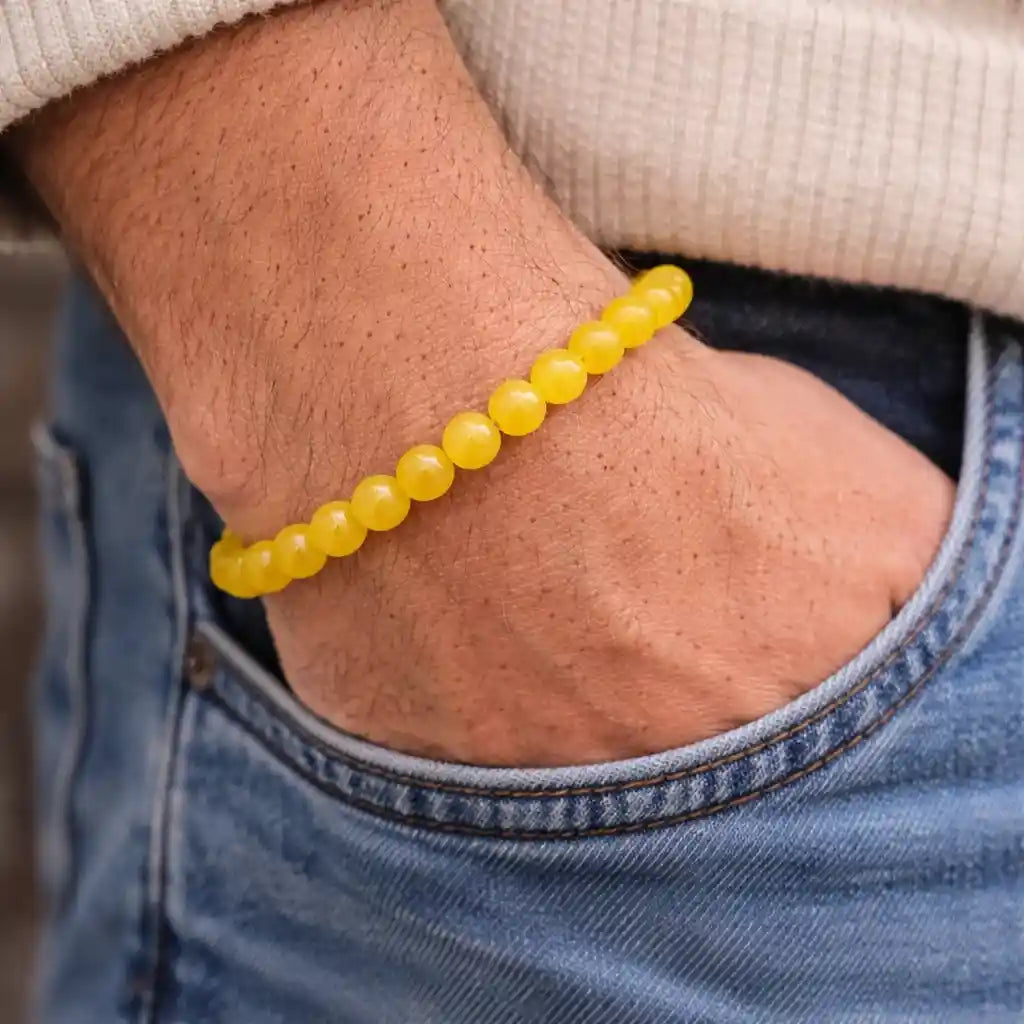 Person Wearing Yellow Jade Bracelet